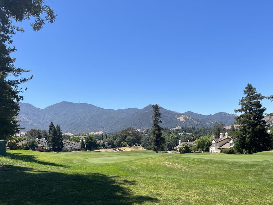 A golf-course fairway and the Mount Diablo range beyond the Chaparral Springs townhomes.