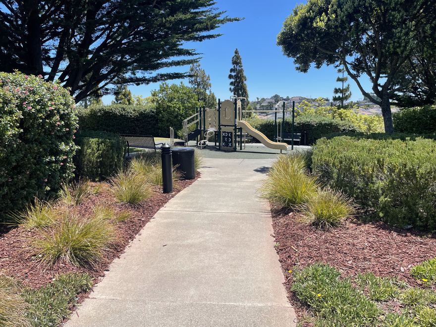 A landscaped path leading to the Marisol playground.