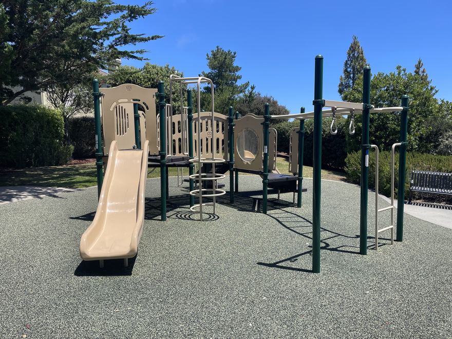 The Marisol playground structure with twin slides and climbers.