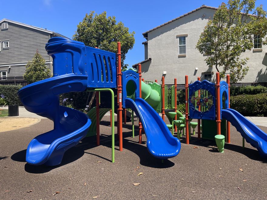 The colorful Merimont playground structure with tube slides.